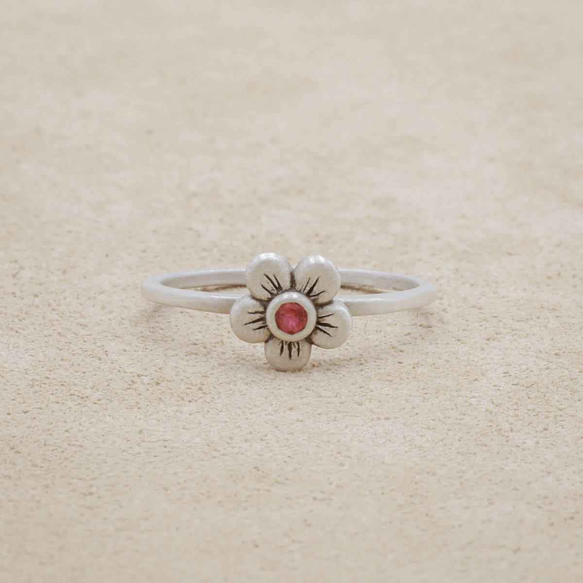 Birthstone bloom ring handcrafted in sterling silver with an antiqued/satin finish set with a 2mm birthstone