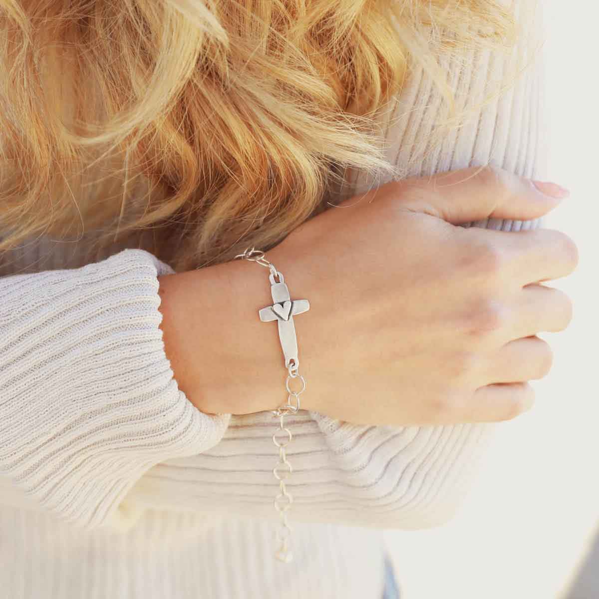 girl wearing sterling silver cross of faith bracelet