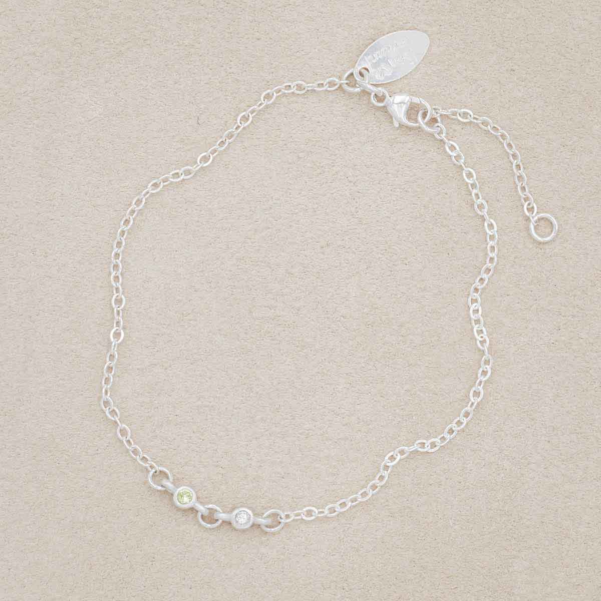 sterling silver Dainty Finespun Birthstone Bracelet - Small, 2mm personalized birthstones, on a beige background