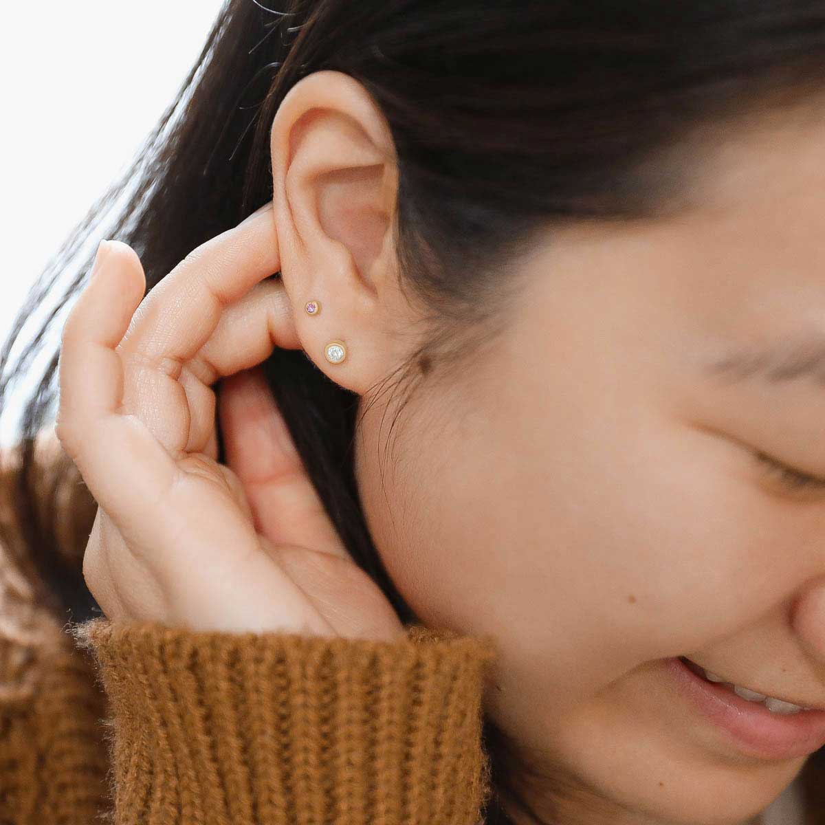 girl wearing 10K yellow gold Dainty Finespun Birthstone Stud Earrings - Small