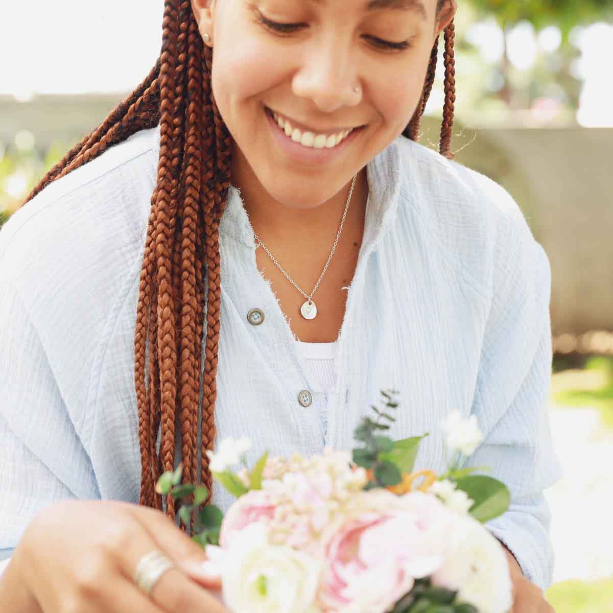 woman wearing a sterling silver full of love necklace
