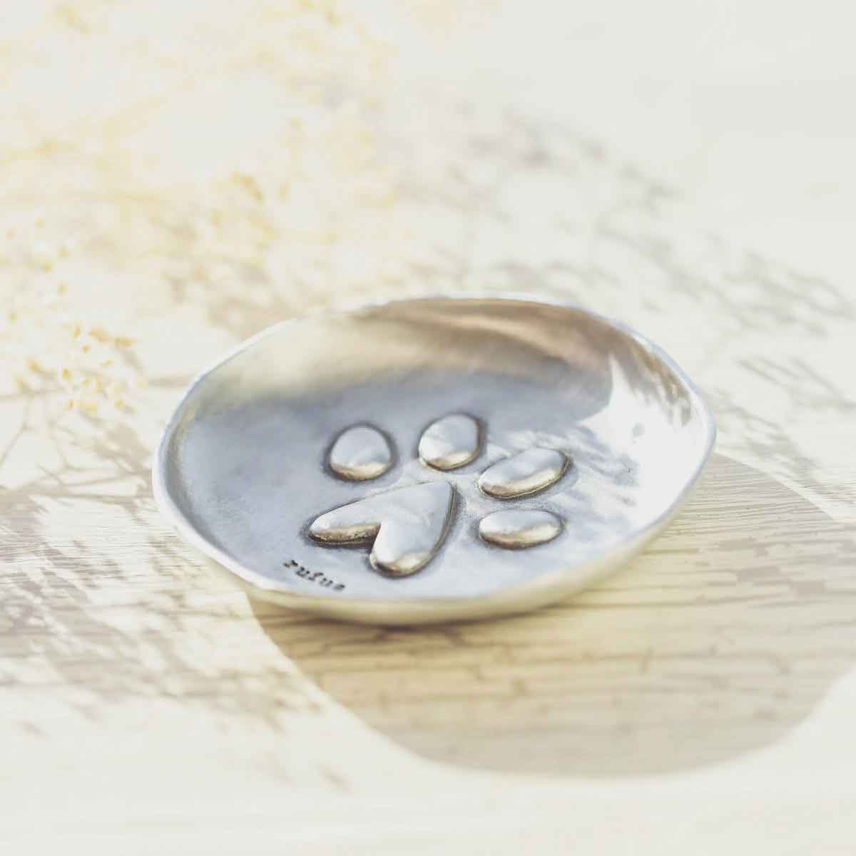 Girl holding a Furry Footprint Keepsake Dish