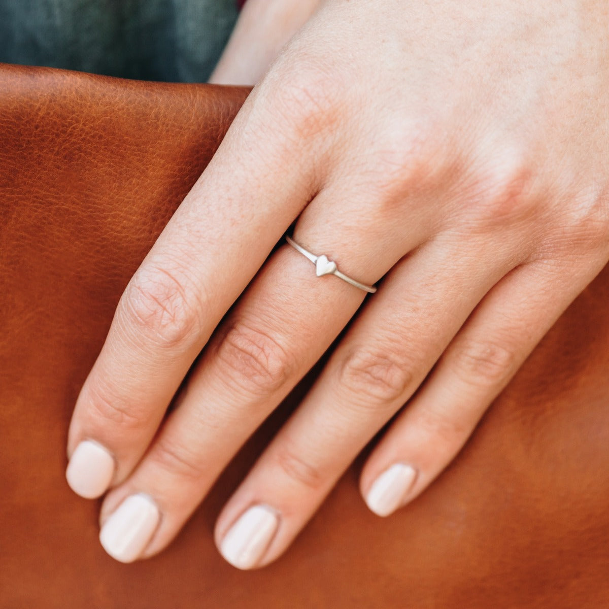 girl wearing a sterling silver sweet love ring - one heart
