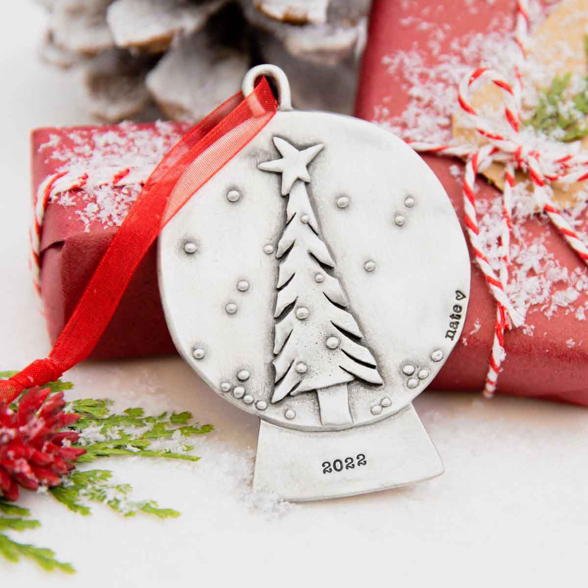 Personalized snow globe ornament, cast in pewter and hand stamped with names, year, and or phrase