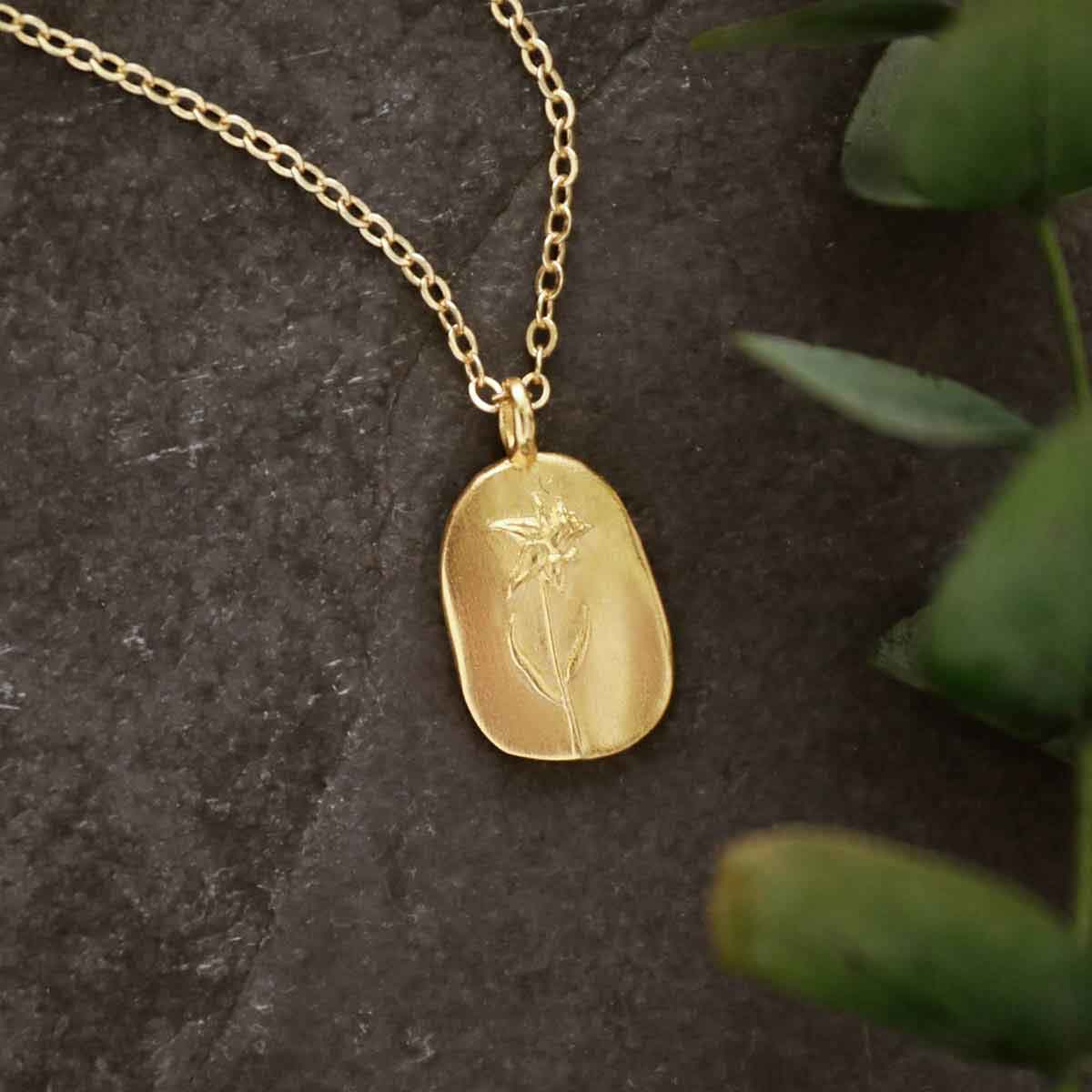 girl holding a gold plated January