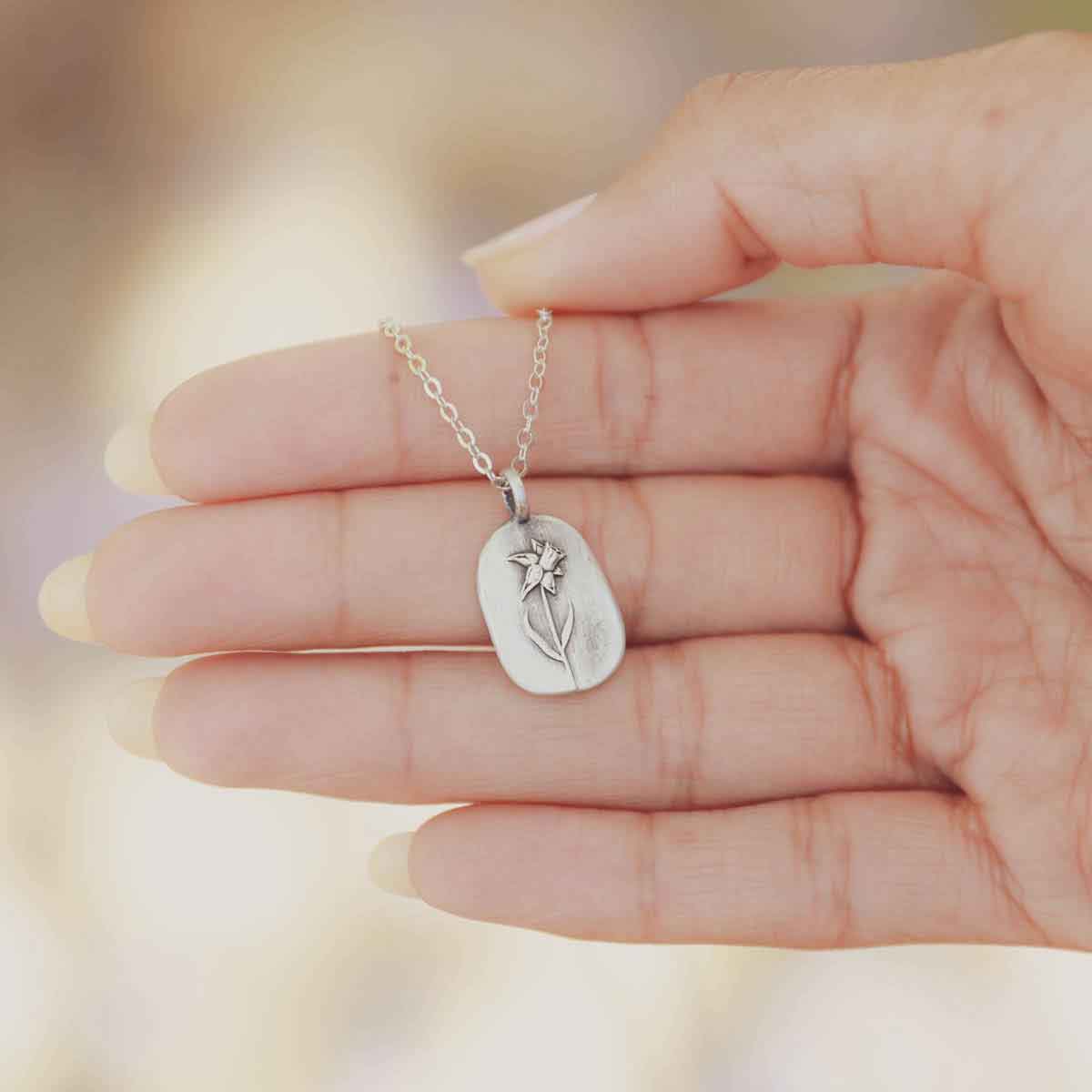 girl wearing a pewter March Birth Flower necklace with an 18" link chain