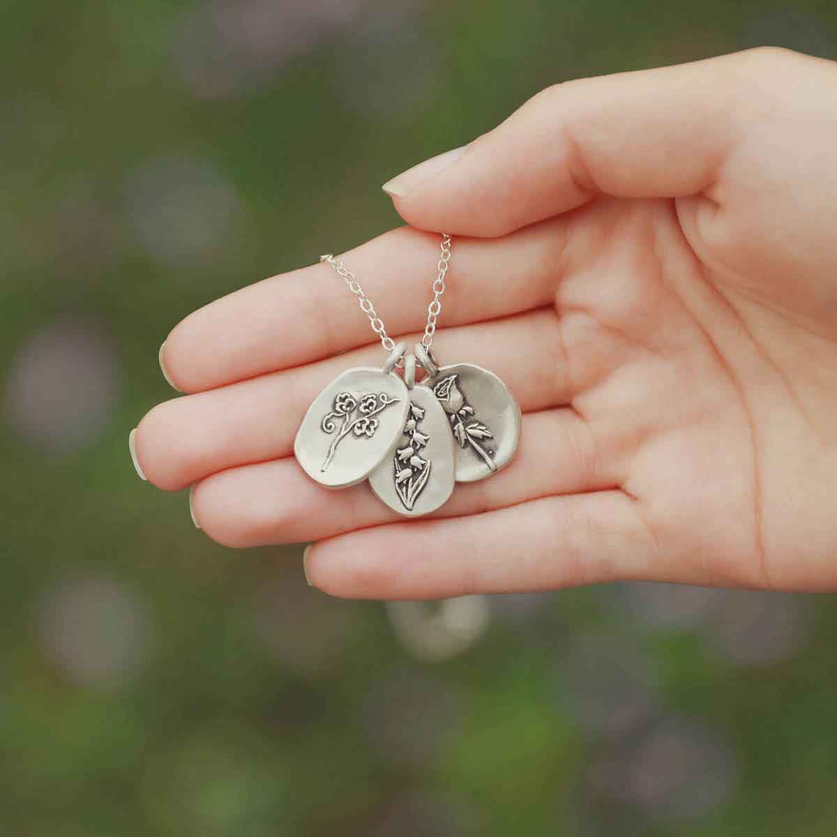 a sterling silver May Birth flower necklace