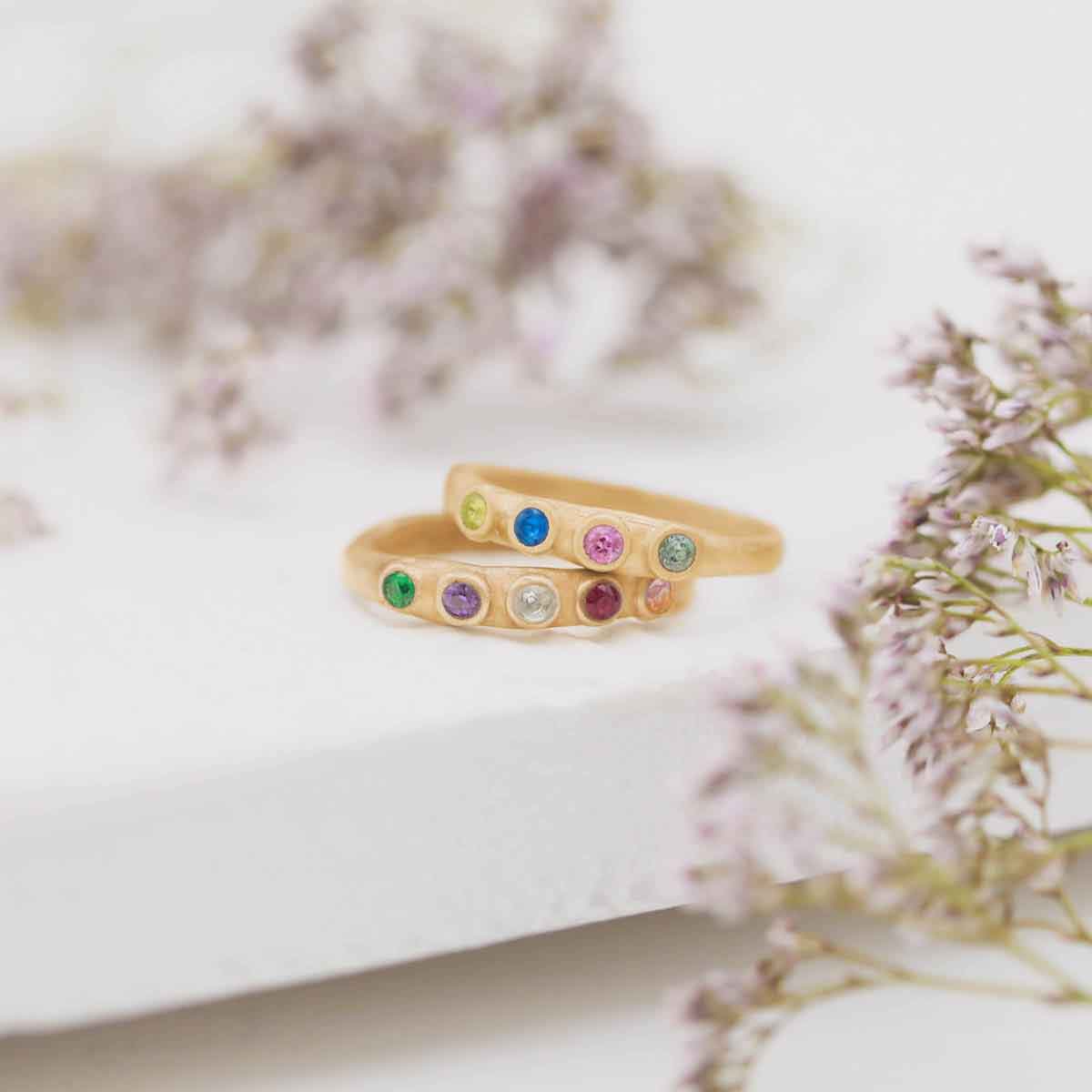 Handcrafted 14k yellow gold mother's rings customizable with up to 6 genuine birthstones
