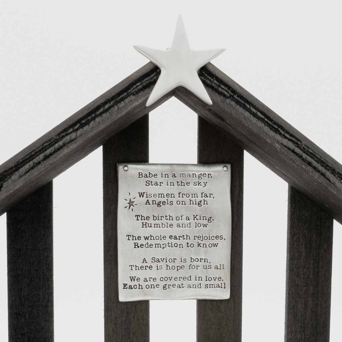 handcrafted wooden nativity stable that includes a pewter star and a hand-stamped poem