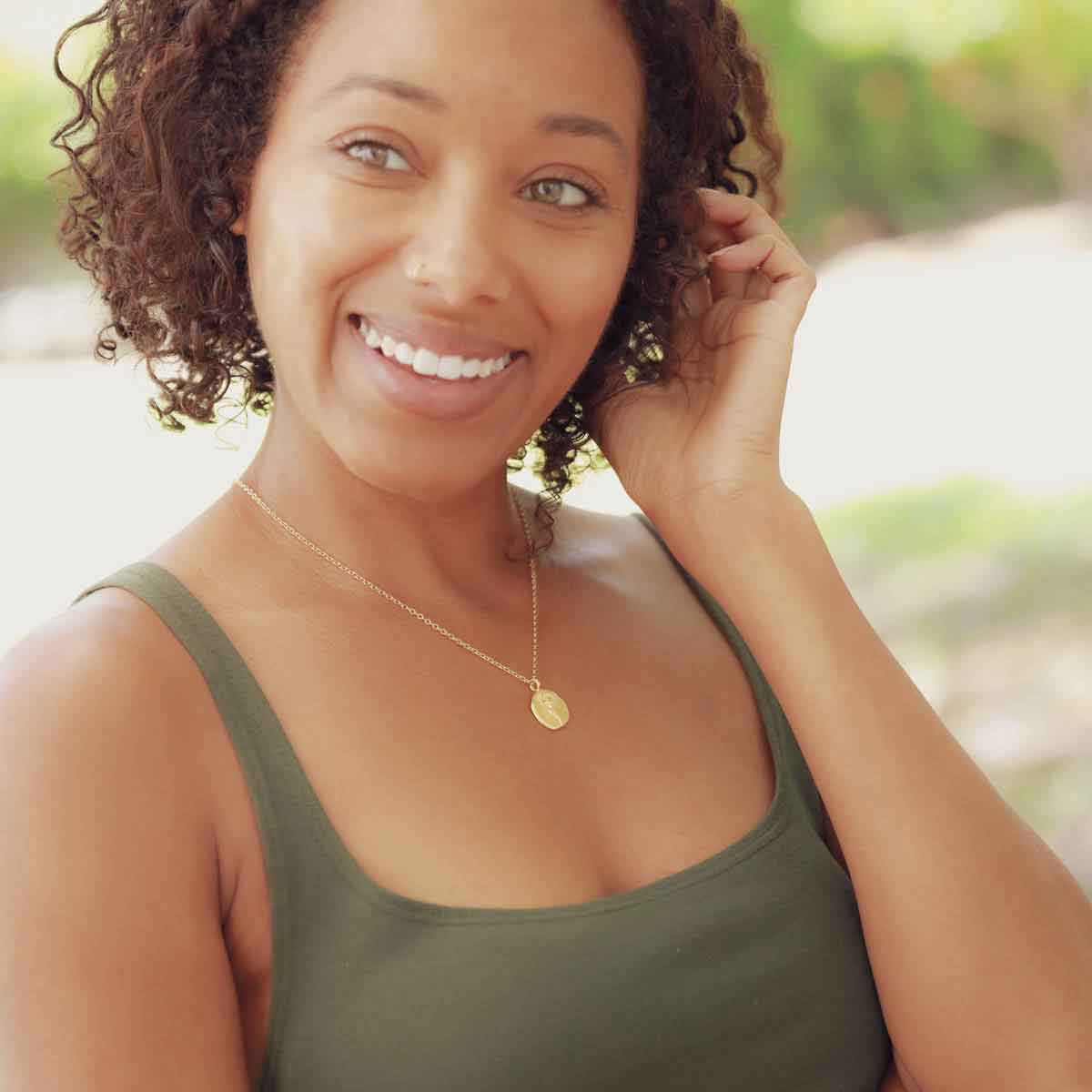 girl wearing a gold plated November birth flower necklace with an 18" gold filled link chain