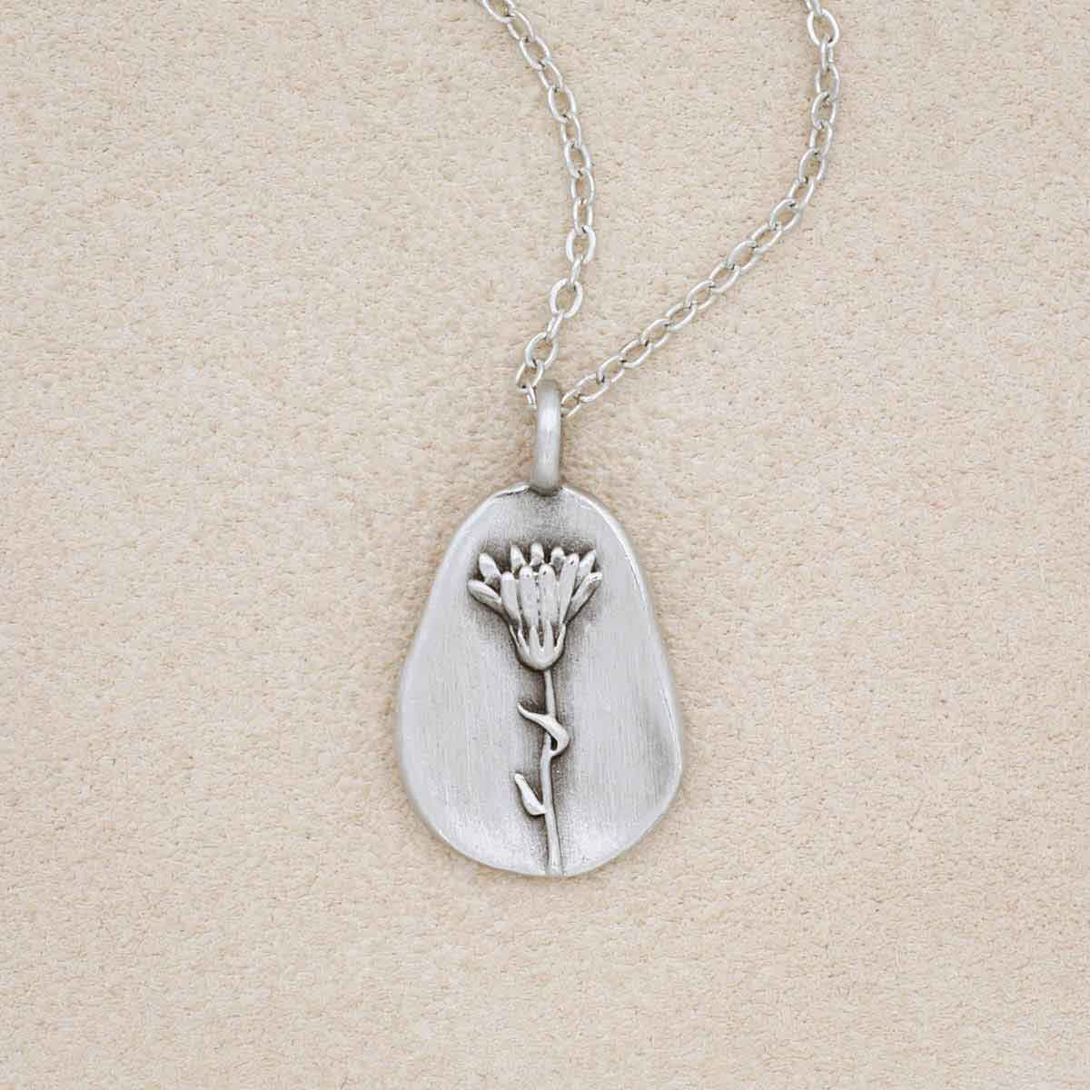 pewter October Birth Flower necklace with 18" link chain, on beige background