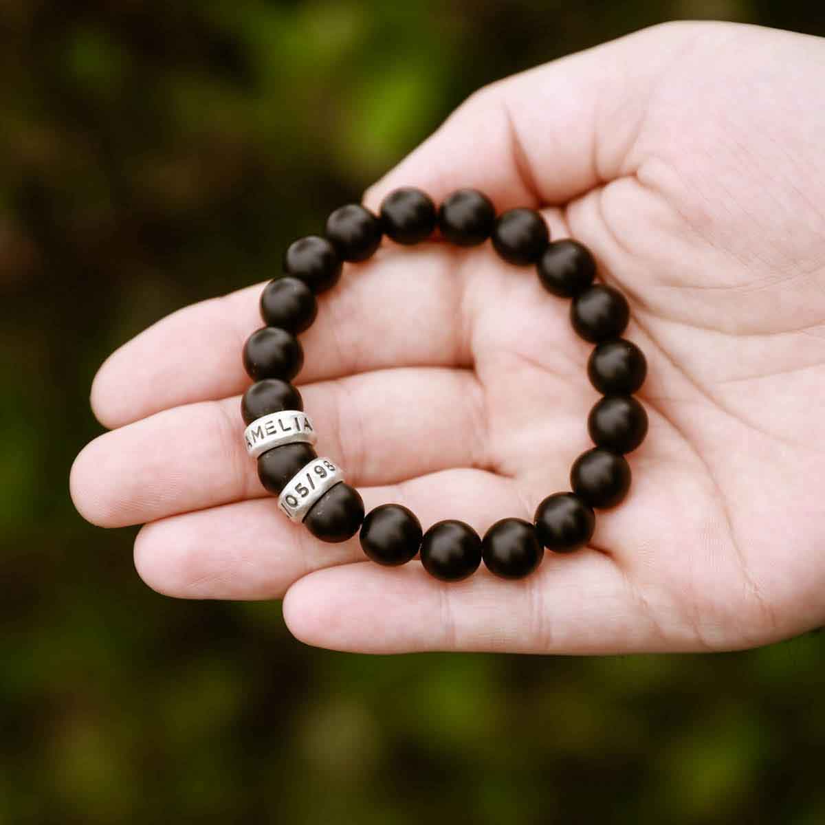 with choice of sterling silver or bronze beads that are customizable with names or dates