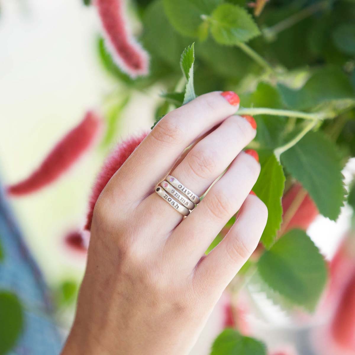 Girl wearing Personalized passage ring handcrafted in sterling silver with your choice of birthstone