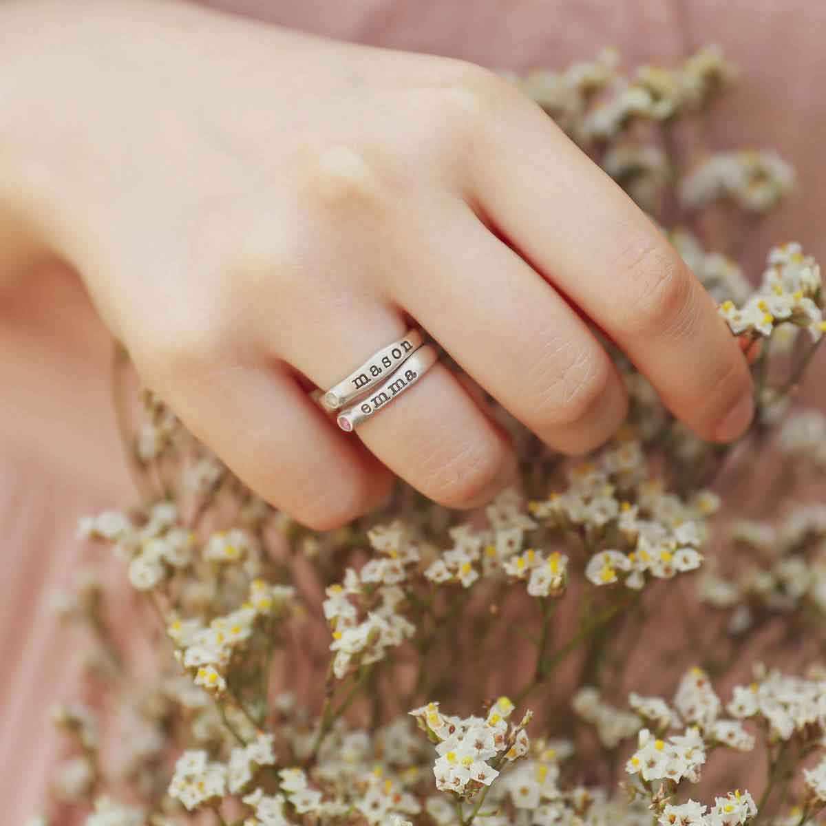 Girl wearing Personalized passage ring handcrafted in sterling silver with her choice of birthstone