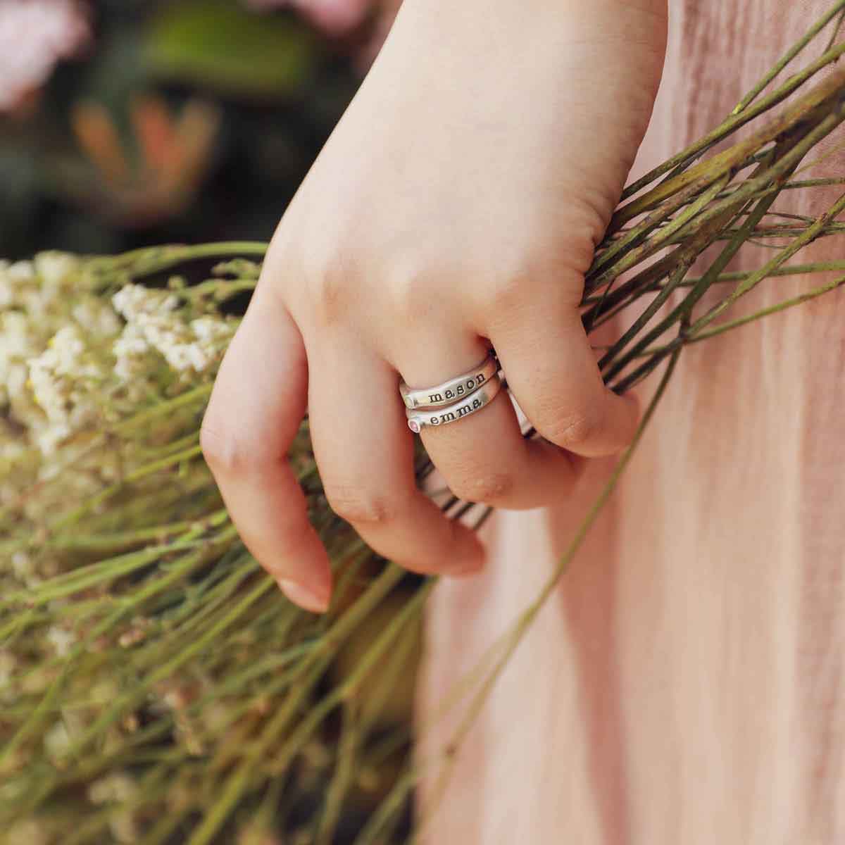 Girl wearing Personalized passage ring handcrafted in sterling silver with her choice of birthstone