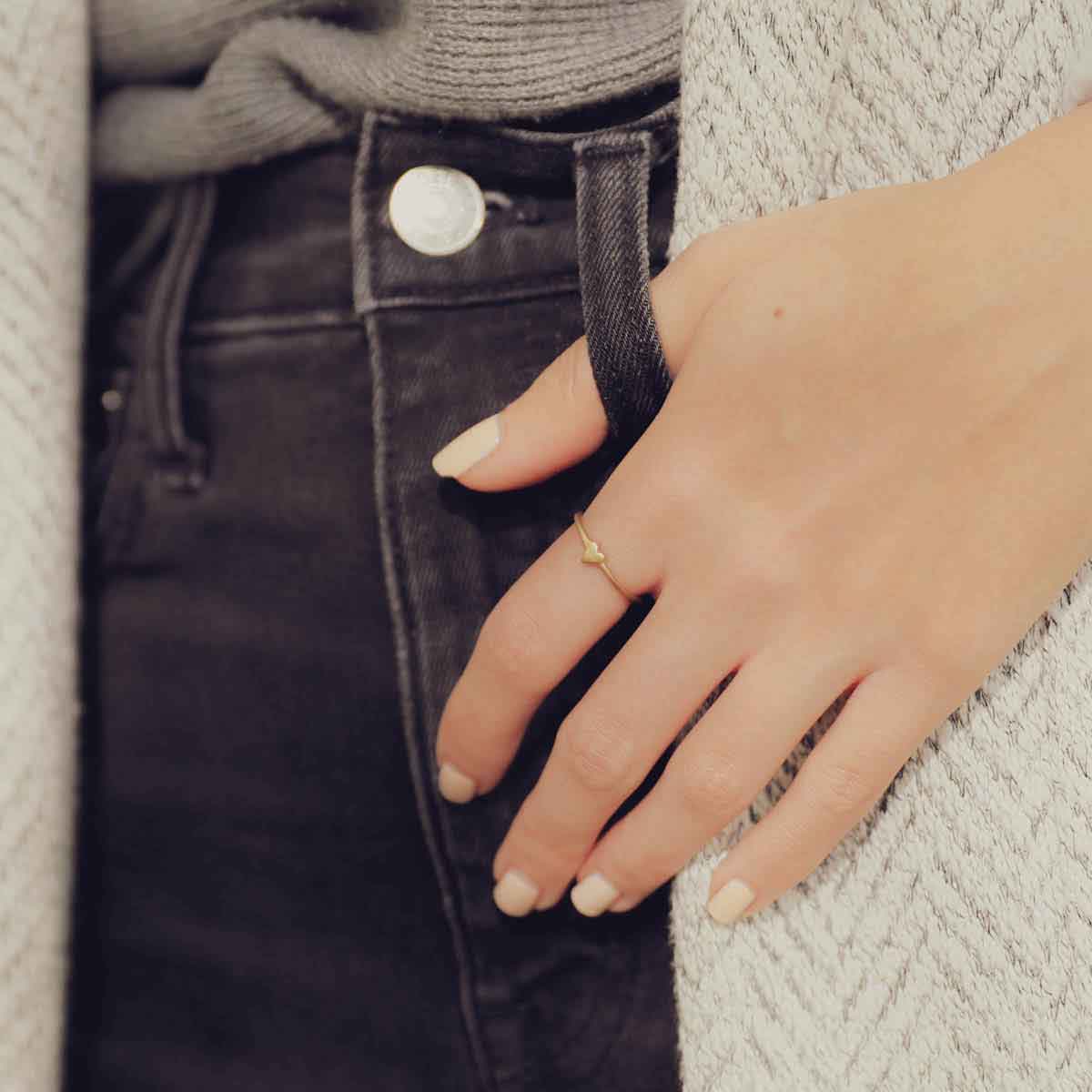 girl wearing a 10k yellow gold sweet love ring - one heart