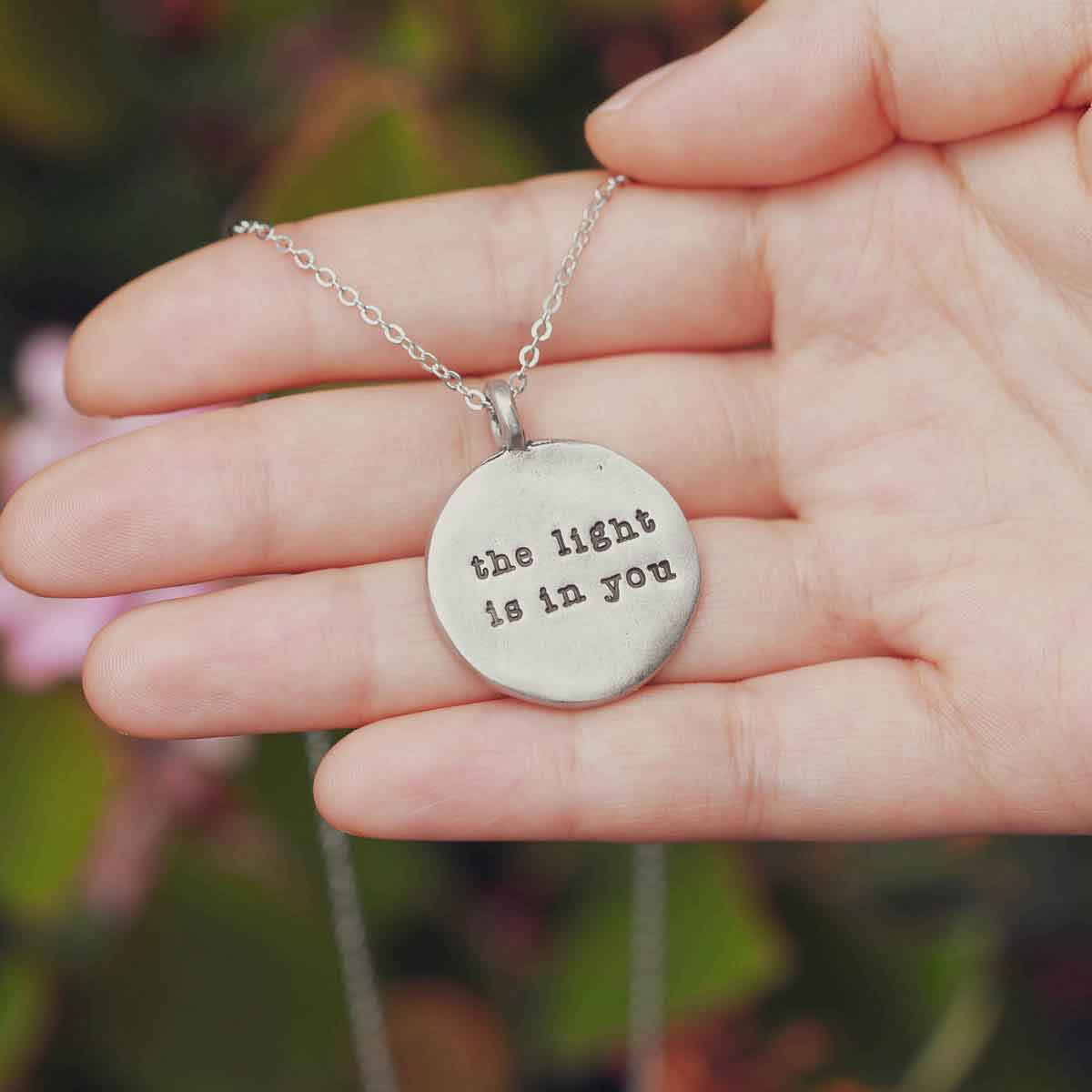 handcrafted in pewter with an 18" silver toned link chain