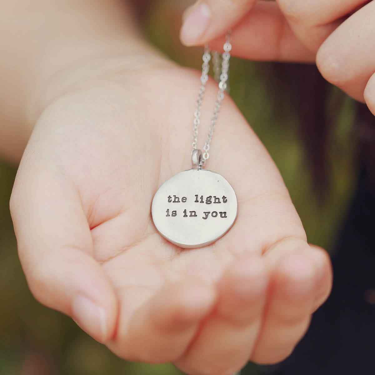 handcrafted in pewter with an 18" silver toned link chain
