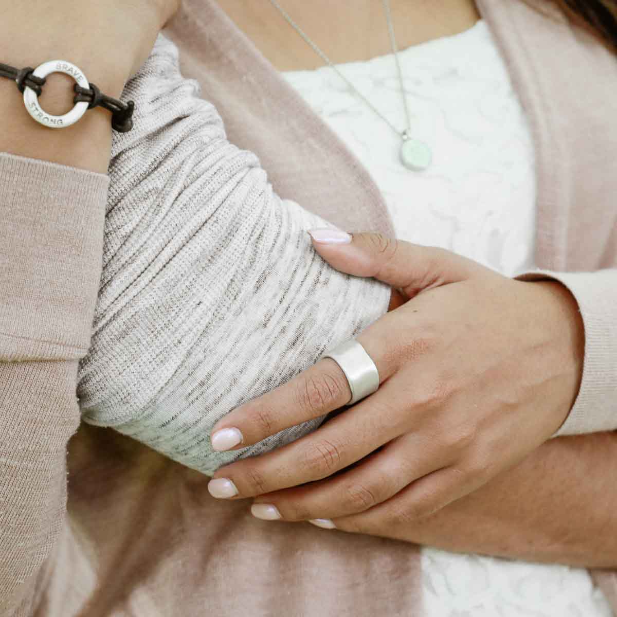 Man wearing Valor Wide ring handcrafted in sterling silver customizable with a meaningful name