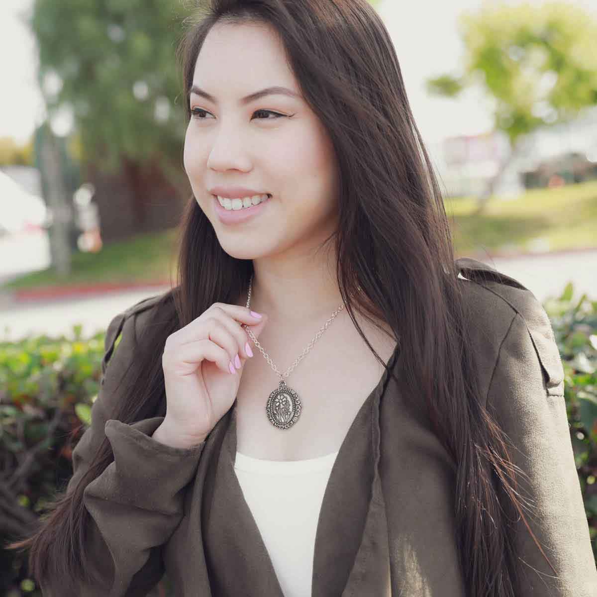girl wearing a pewter vintage cameo necklace
