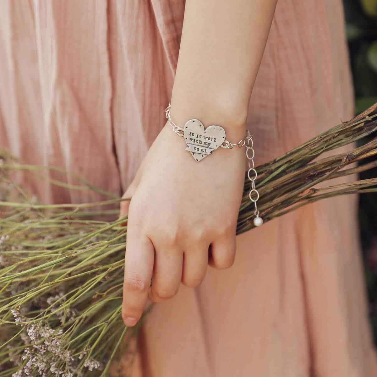 engraved well with my soul pewter bracelet on a book