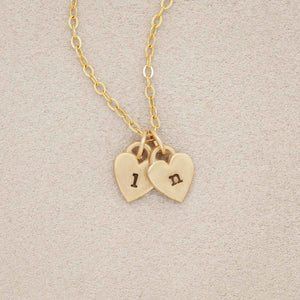 Cherished hearts initials necklace handcrafted in 10k yellow gold including two customizable charms