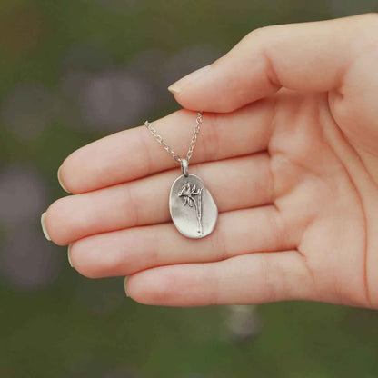 a pewter December birth flower necklace with an 18" link chain