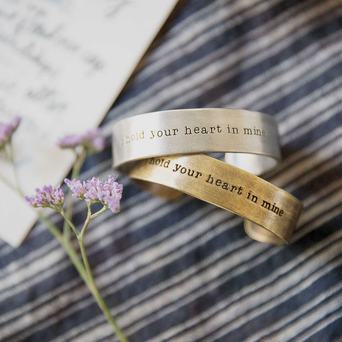 Pair of Handcrafted artisan bronze-plated pewter I hold your heart cuff bracelets