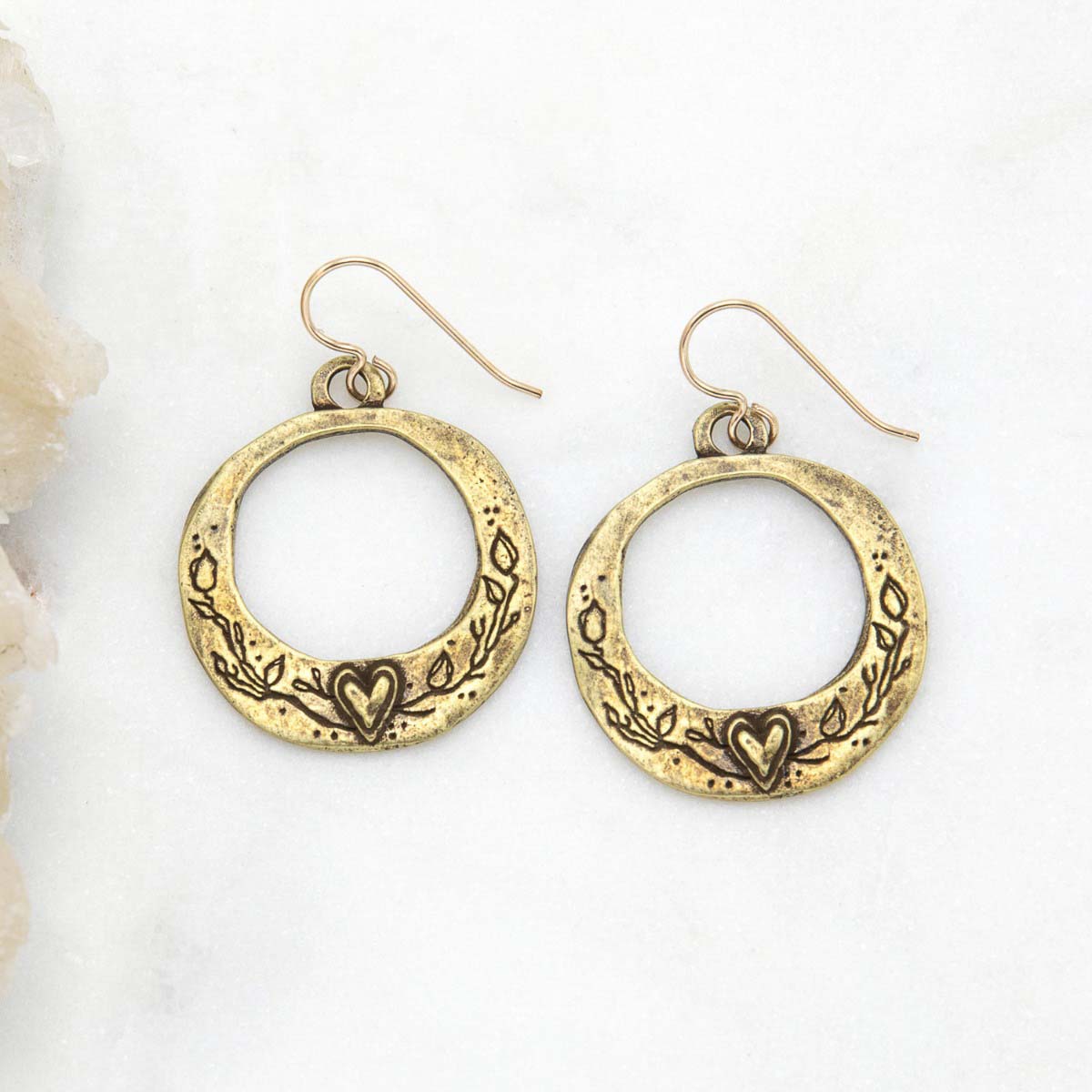 pair of let love grow hoop earrings in bronze