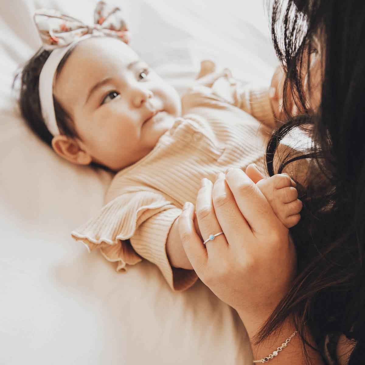  while holding baby