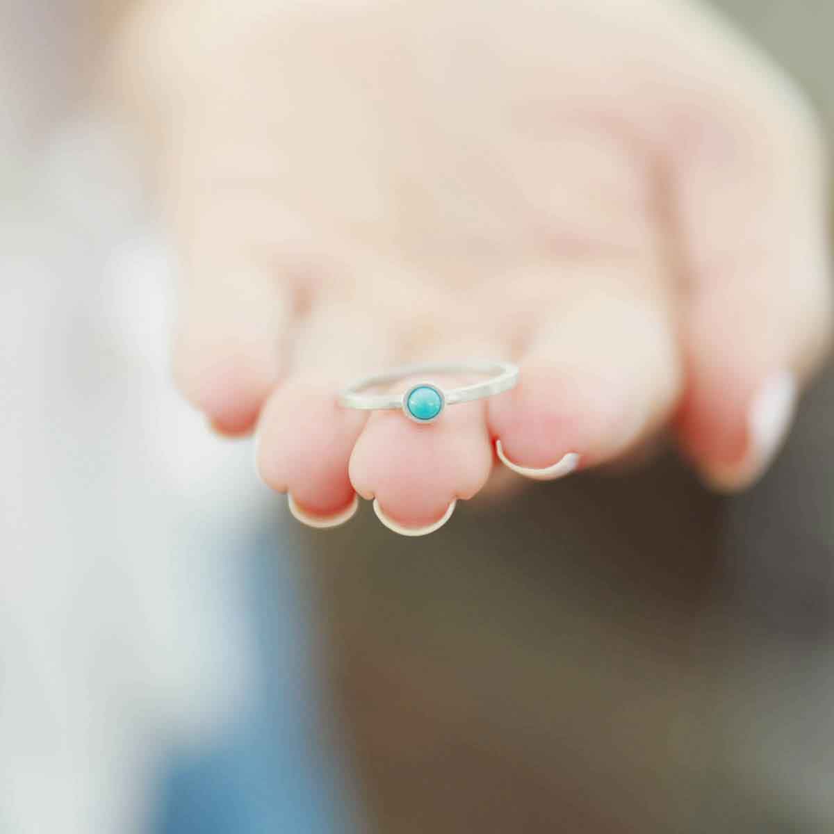 mom wearing a sterling silver Lighthearted Turquoise Ring 