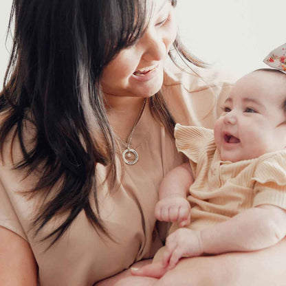 woman wearing sterling silver open circle pearl necklace