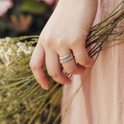 Girl wearing Personalized passage ring handcrafted in sterling silver with her choice of birthstone 