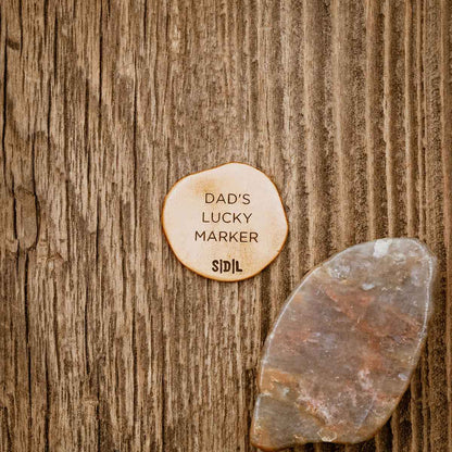 Personalized Bronze Roman Cross Coin Golf Ball Marker on wood background