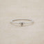 sterling silver Sweet Love Initial Ring - One Heart, personalized with an initial, on a beige background