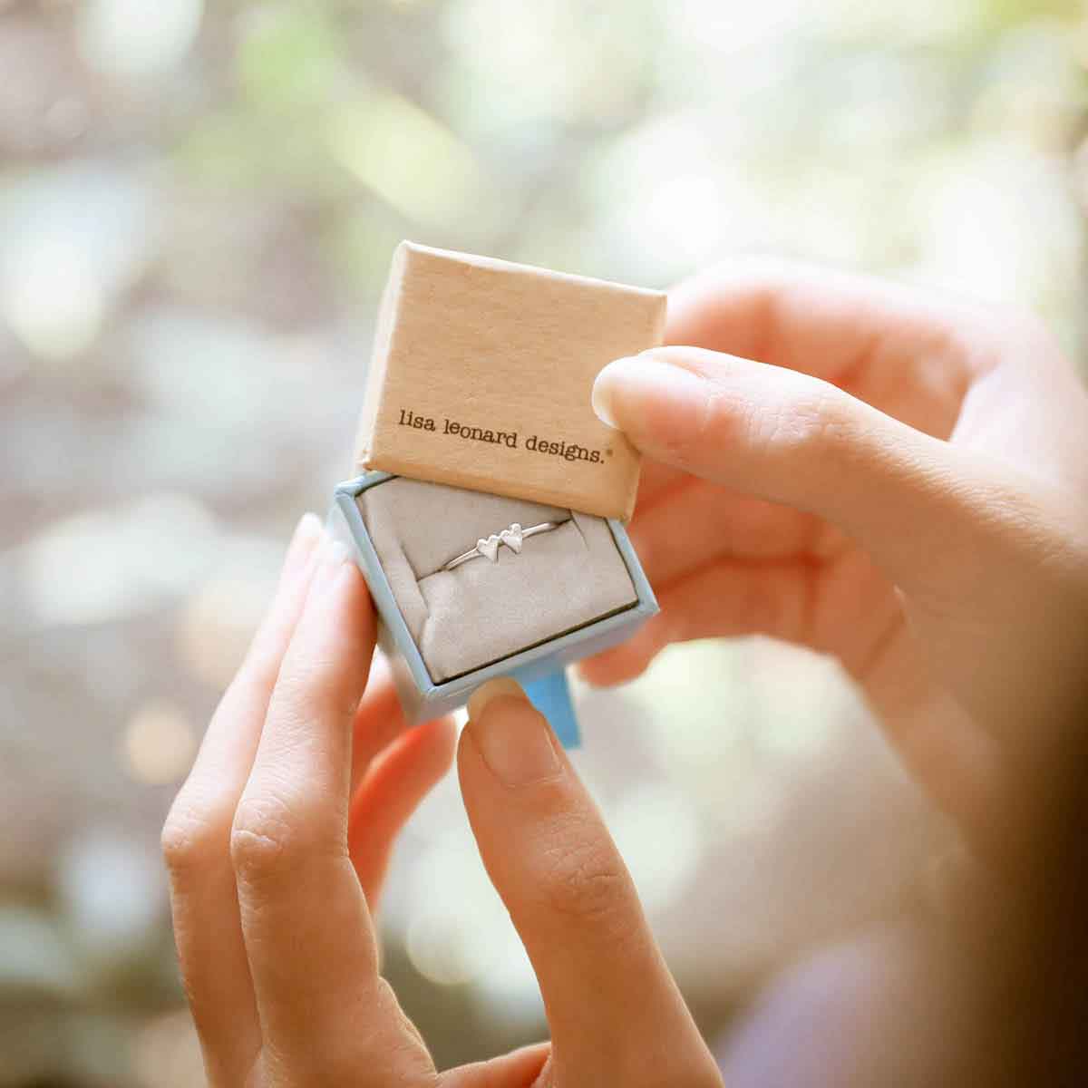 girl wearing sterling silver sweet love ring - two hearts